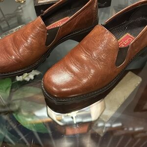 Cole Haan slide on loafer with mud grip soles.